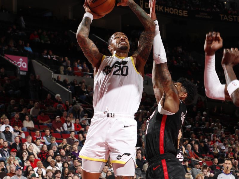 PORTLAND, OR - DECEMBER 6: John Collins #20 of the Utah Jazz drives to the basket during the game against the Portland Trail Blazers on December 6, 2024 at the Moda Center Arena in Portland, Oregon. NOTE TO USER: User expressly acknowledges and agrees that, by downloading and or using this photograph, user is consenting to the terms and conditions of the Getty Images License Agreement. Mandatory Copyright Notice: Copyright 2024 NBAE (Photo by Cameron Browne/NBAE via Getty Images)