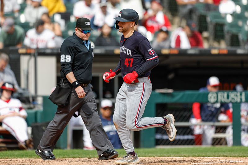 Sep 17, 2023; Chicago, Illinois, USA; Minnesota Twins second baseman Edouard Julien (47) crosses home plate after hitting a three-run home run against the Chicago White Sox during the fifth inning at Guaranteed Rate Field. Mandatory Credit: Kamil Krzaczynski-USA TODAY Sports