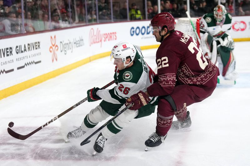 Mar 12, 2023; Tempe, Arizona, USA; Minnesota Wild center Connor Dewar (26) skates against Arizona Coyotes center Jack McBain (22) during the second period at Mullett Arena. Mandatory Credit: Joe Camporeale-USA TODAY Sports