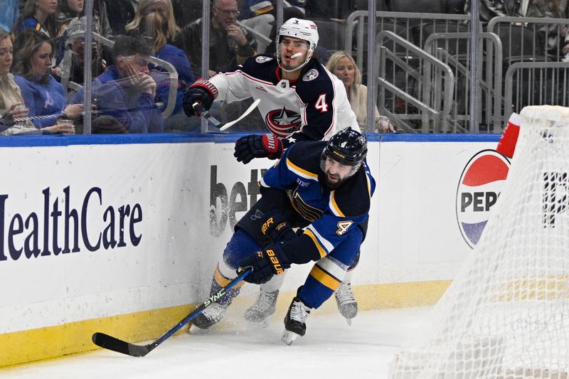 Jan 30, 2024; St. Louis, Missouri, USA; St. Louis Blues defenseman Nick Leddy (4) finishes his check on Columbus Blue Jackets center Cole Sillinger (4) during the first period at Enterprise Center. Mandatory Credit: Jeff Le-USA TODAY Sports