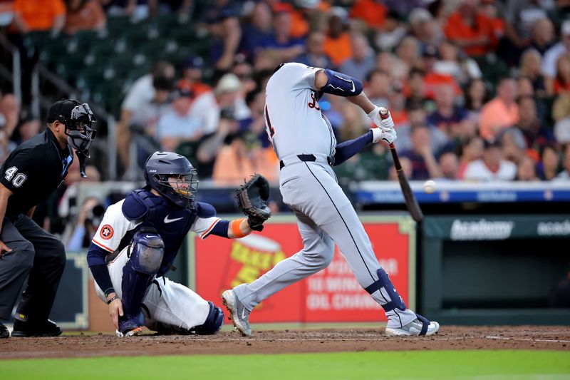 Apr 30, 2025; Houston, Texas, USA; Detroit Tigers right fielder Riley Greene (31) hits a single against the Houston Astros during the third inning at Daikin Park. Mandatory Credit: Erik Williams-Imagn Images
