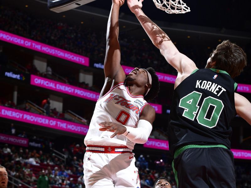 HOUSTON, TX - JANUARY 21: Aaron Holiday #0 of the Houston Rockets shoots the ball during the game against the Boston Celtics on January 21, 2024 at the Toyota Center in Houston, Texas. NOTE TO USER: User expressly acknowledges and agrees that, by downloading and or using this photograph, User is consenting to the terms and conditions of the Getty Images License Agreement. Mandatory Copyright Notice: Copyright 2024 NBAE (Photo by Logan Riely/NBAE via Getty Images)