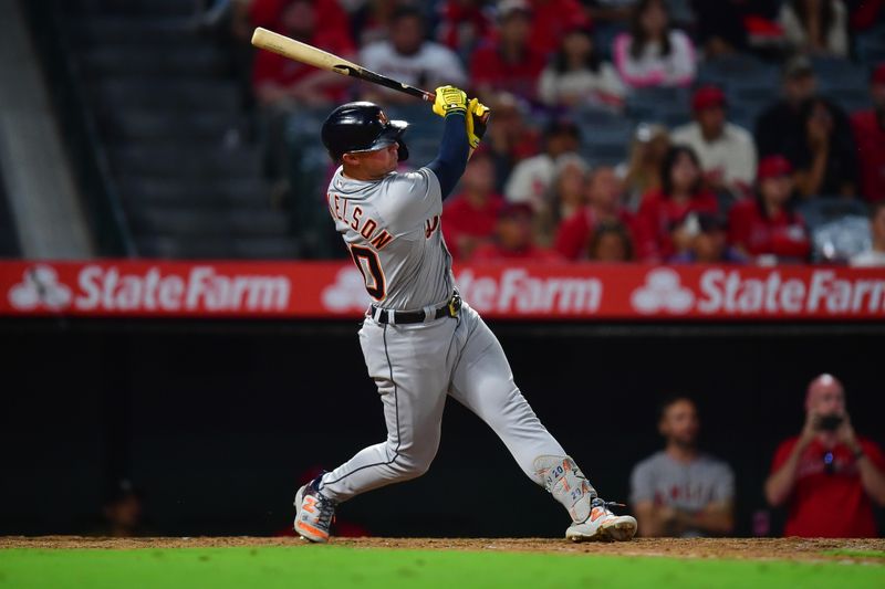 Sep 15, 2023; Anaheim, California, USA; Detroit Tigers first baseman Spencer Torkelson (20) hits an RBI double against the Los Angeles Angels during the eighth inning at Angel Stadium. Mandatory Credit: Gary A. Vasquez-USA TODAY Sports