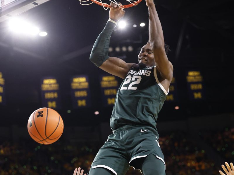 Feb 18, 2023; Ann Arbor, Michigan, USA;  Michigan State Spartans center Mady Sissoko (22) dunks against the Michigan Wolverines in the second half at Crisler Center. Mandatory Credit: Rick Osentoski-USA TODAY Sports