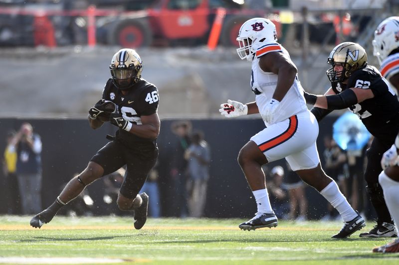 Nov 4, 2023; Nashville, Tennessee, USA; Vanderbilt Commodores running back AJ Newberry (46) runs for a short gain during the first half against the Auburn Tigers at FirstBank Stadium. Mandatory Credit: Christopher Hanewinckel-USA TODAY Sports