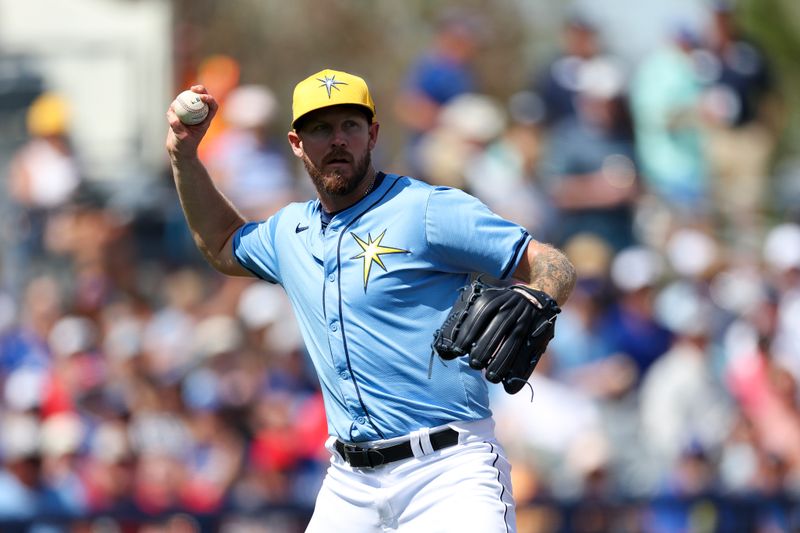 Mar 11, 2024; Port Charlotte, Florida, USA;  Tampa Bay Rays relief pitcher Chris Devenski (48) throws to first for an out against the Toronto Blue Jays in the fourth inning at Charlotte Sports Park. Mandatory Credit: Nathan Ray Seebeck-USA TODAY Sports