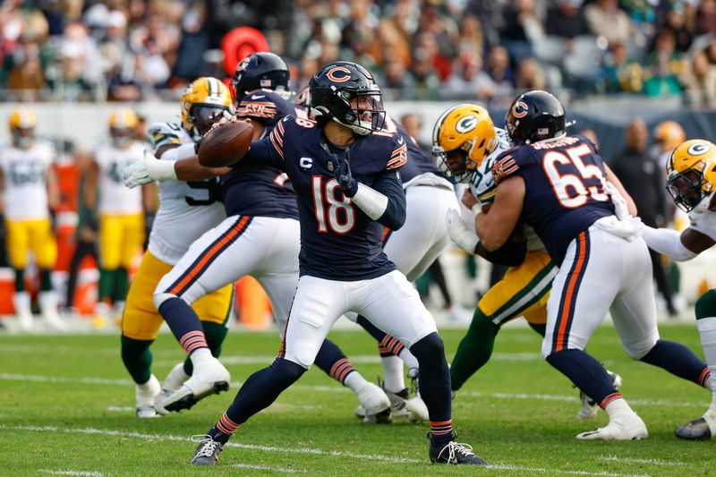 Chicago Bears quarterback Caleb Williams (18) looks to pass the ball against the Green Bay Packers during the first half of an NFL football game, Sunday, Nov. 17, 2024, in Chicago. (AP Photo/Kamil Krzaczynski)