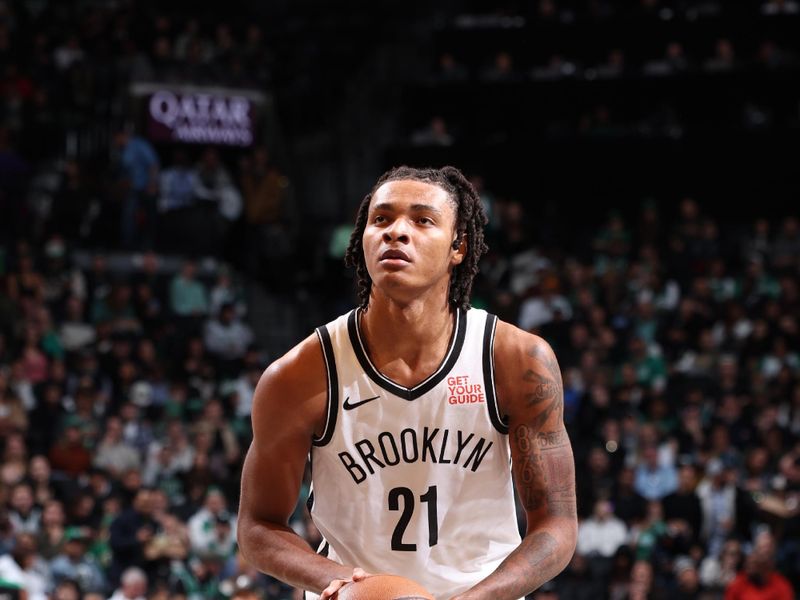 BROOKLYN, NY - NOVEMBER 13: Noah Clowney #21 of the Brooklyn Nets  shoots a free throw during the game against the Boston Celtics on November 13, 2024 at Barclays Center in Brooklyn, New York. NOTE TO USER: User expressly acknowledges and agrees that, by downloading and or using this Photograph, user is consenting to the terms and conditions of the Getty Images License Agreement. Mandatory Copyright Notice: Copyright 2024 NBAE (Photo by Jeff Haynes/NBAE via Getty Images)