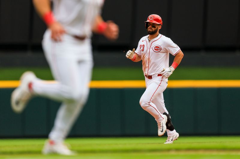 May 23, 2024; Cincinnati, Ohio, USA; Cincinnati Reds outfielder Nick Martini (23) runs the bases after hitting a two-run home run in the sixth inning against the San Diego Padres at Great American Ball Park. Mandatory Credit: Katie Stratman-USA TODAY Sports