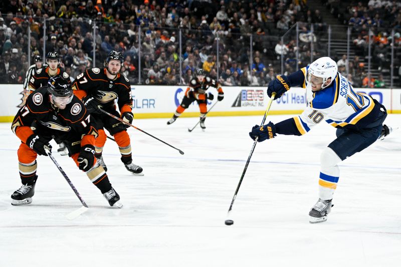 Mar 25, 2023; Anaheim, California, USA; St. Louis Blues center Brayden Schenn (10) shoots a shot against the Anaheim Ducks during the second period at Honda Center. Mandatory Credit: Kelvin Kuo-USA TODAY Sports