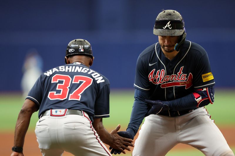 Jul 9, 2023; St. Petersburg, Florida, USA;  Atlanta Braves catcher Travis d'Arnaud (16) celebrates with third base coach Ron Washington (37) as he runs the bases after hitting a solo home run against the Tampa Bay Rays in the fourth inning at Tropicana Field. Mandatory Credit: Nathan Ray Seebeck-USA TODAY Sports