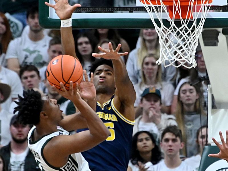 Jan 7, 2023; East Lansing, Michigan, USA;  Michigan State Spartans guard A.J. Hoggard (11) drives to the basket in the first half at Jack Breslin Student Events Center. Mandatory Credit: Dale Young-USA TODAY Sports