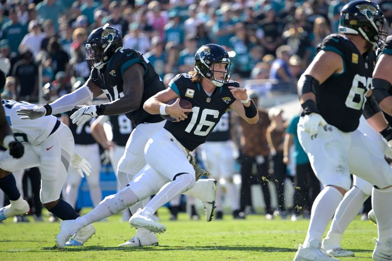 Jacksonville Jaguars quarterback Trevor Lawrence (16) scrambles for yardage during the first half of an NFL football game against the Tennessee Titans, Sunday, Nov. 19, 2023, in Jacksonville, Fla. (AP Photo/Phelan M. Ebenhack)