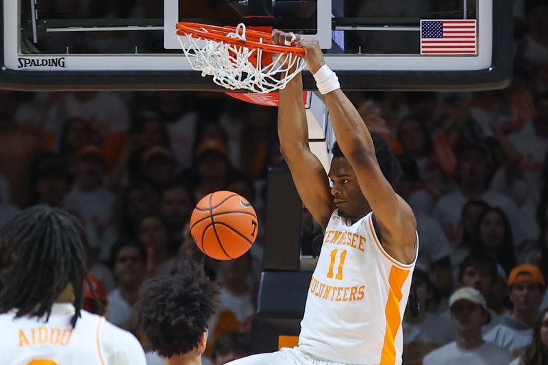 Feb 24, 2024; Knoxville, Tennessee, USA; Tennessee Volunteers forward Tobe Awaka (11) dunks the ball against the Texas A&M Aggies during the first half at Thompson-Boling Arena at Food City Center. Mandatory Credit: Randy Sartin-USA TODAY Sports