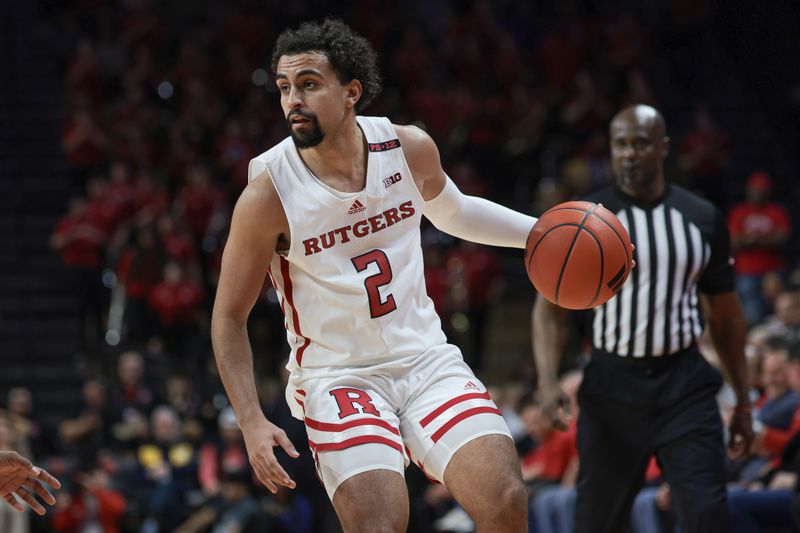 Nov 27, 2023; Piscataway, New Jersey, USA; Rutgers Scarlet Knights guard Noah Fernandes (2) dribbles during the second half against the St. Peter's Peacocks at Jersey Mike's Arena. Mandatory Credit: Vincent Carchietta-USA TODAY Sports