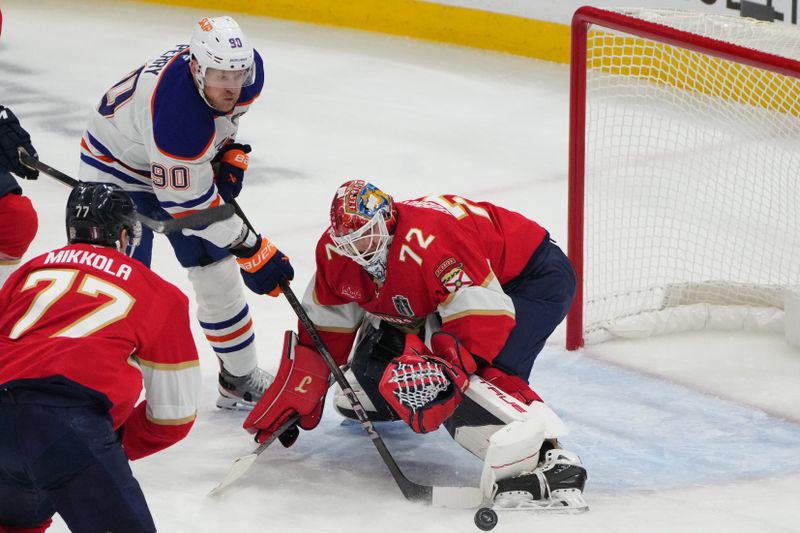Jun 9, 2025; Sunrise, Florida, USA; Florida Panthers goaltender Sergei Bobrovsky (72) reaches for a loose puck against Edmonton Oilers right wing Corey Perry (90) in game three of the 2025 Stanley Cup Final at Amerant Bank Arena. Mandatory Credit: Jim Rassol-Imagn Images