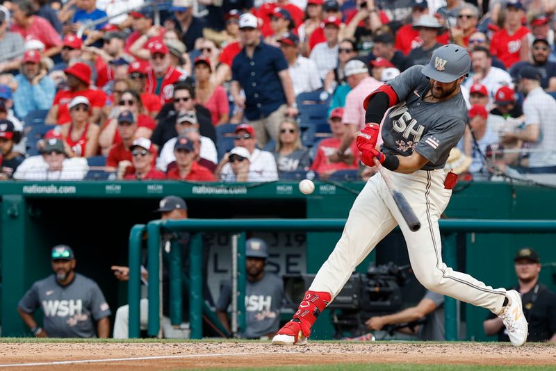 May 25, 2024; Washington, District of Columbia, USA; Washington Nationals first baseman Joey Gallo (24) hits an RBI single against the Seattle Mariners during the seventh inning at Nationals Park. Mandatory Credit: Geoff Burke-USA TODAY Sports