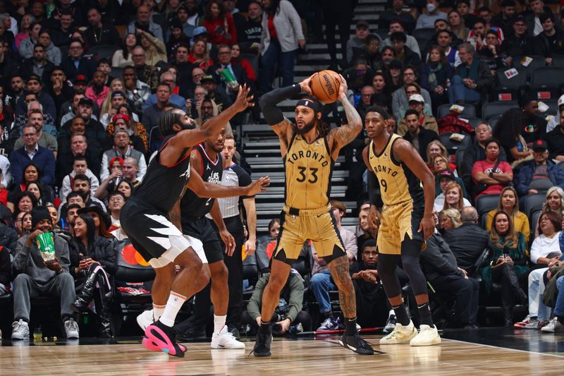 TORONTO, CANADA - JANUARY 26: Gary Trent Jr. #33 of the Toronto Raptors handles the ball during the game against the LA Clippers on January 26, 2024 at the Scotiabank Arena in Toronto, Ontario, Canada.  NOTE TO USER: User expressly acknowledges and agrees that, by downloading and or using this Photograph, user is consenting to the terms and conditions of the Getty Images License Agreement.  Mandatory Copyright Notice: Copyright 2024 NBAE (Photo by Vaughn Ridley/NBAE via Getty Images)