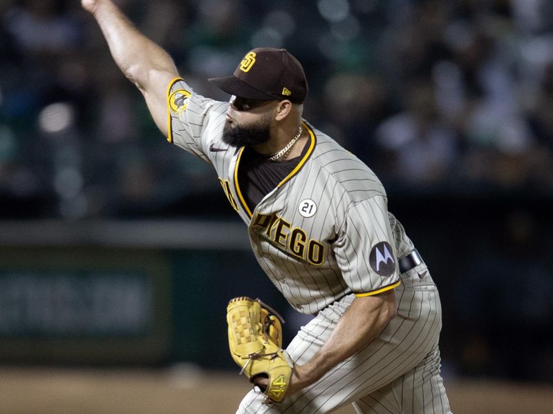 Sep 15, 2023; Oakland, California, USA; San Diego Padres pitcher Luis Garc  a (66) delivers a pitch against the Oakland Athletics during the ninth inning at Oakland-Alameda County Coliseum. Mandatory Credit: D. Ross Cameron-USA TODAY Sports