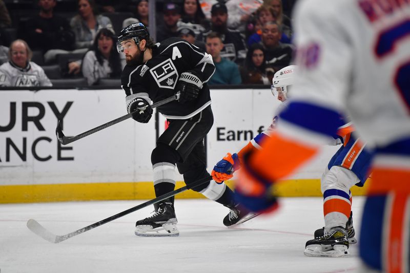 Mar 11, 2024; Los Angeles, California, USA; Los Angeles Kings defenseman Drew Doughty (8) shoots on goal against the New York Islanders during the second period at Crypto.com Arena. Mandatory Credit: Gary A. Vasquez-USA TODAY Sports