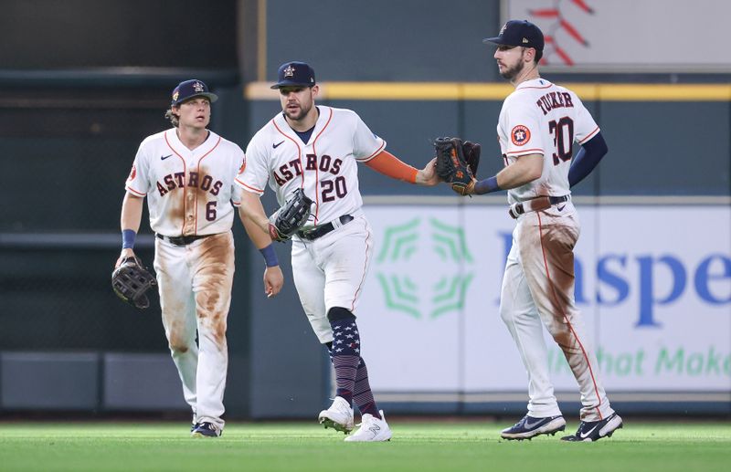Jul 4, 2023; Houston, Texas, USA; Houston Astros left fielder Chas McCormick (20) celebrates with center fielder Jake Meyers (6) and right fielder Kyle Tucker (30) after the game against the Colorado Rockies at Minute Maid Park. Mandatory Credit: Troy Taormina-USA TODAY Sports