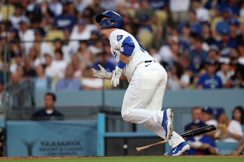 Jul 5, 2024; Los Angeles, California, USA;  Los Angeles Dodgers catcher Will Smith (16) hits a solo home run during the third inning against the Milwaukee Brewers at Dodger Stadium. Mandatory Credit: Kiyoshi Mio-USA TODAY Sports