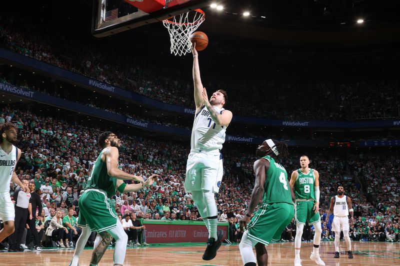 BOSTON, MA - JUNE 17: Luka Doncic #77 of the Dallas Mavericks drives to the basket during the game against the Boston Celtics during Game 5 of the 2024 NBA Finals on June 17, 2024 at the TD Garden in Boston, Massachusetts. NOTE TO USER: User expressly acknowledges and agrees that, by downloading and or using this photograph, User is consenting to the terms and conditions of the Getty Images License Agreement. Mandatory Copyright Notice: Copyright 2024 NBAE  (Photo by Nathaniel S. Butler/NBAE via Getty Images)