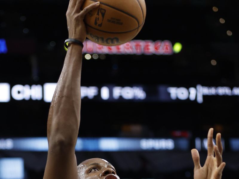 SAN ANTONIO, TX - DECEMBER 08:  Charles Bassey #28 of the San Antonio Spurs takes warm up shots before their game against the Chicago Bulls at Frost Bank Center on December  08 2023 in San Antonio, Texas. NOTE TO USER: User expressly acknowledges and agrees that, by downloading and or using this photograph, User is consenting to terms and conditions of the Getty Images License Agreement. (Photo by Ronald Cortes/Getty Images)