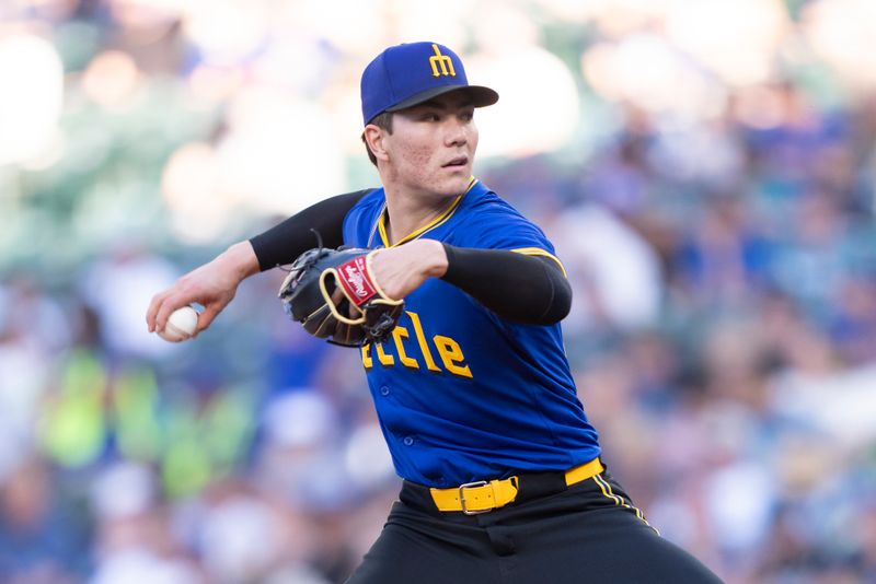 May 8, 2024; Seattle, Washington, USA; Seattle Mariners starter Bryan Woo (22) delivers a pitch during the first inning against the Oakland Athletics at Lumen Field. Mandatory Credit: Stephen Brashear-USA TODAY Sports