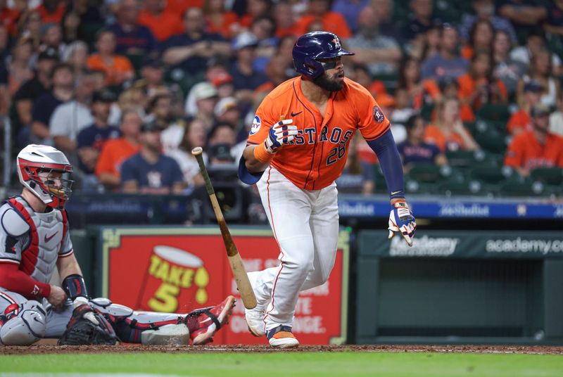 May 31, 2024; Houston, Texas, USA; Houston Astros first baseman Jon Singleton (28) hits a single during the fourth inning against the Minnesota Twins at Minute Maid Park. Mandatory Credit: Troy Taormina-USA TODAY Sports