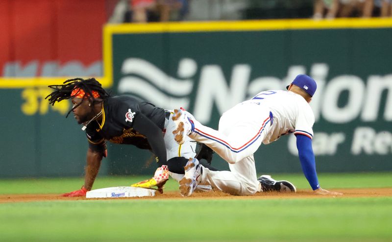 Aug 20, 2024; Arlington, Texas, USA; Pittsburgh Pirates designated hitter Oneil Cruz (15) slides into second base with a double in front of Texas Rangers second baseman Marcus Semien (2) during the seventh inning at Globe Life Field. Mandatory Credit: Kevin Jairaj-USA TODAY Sports