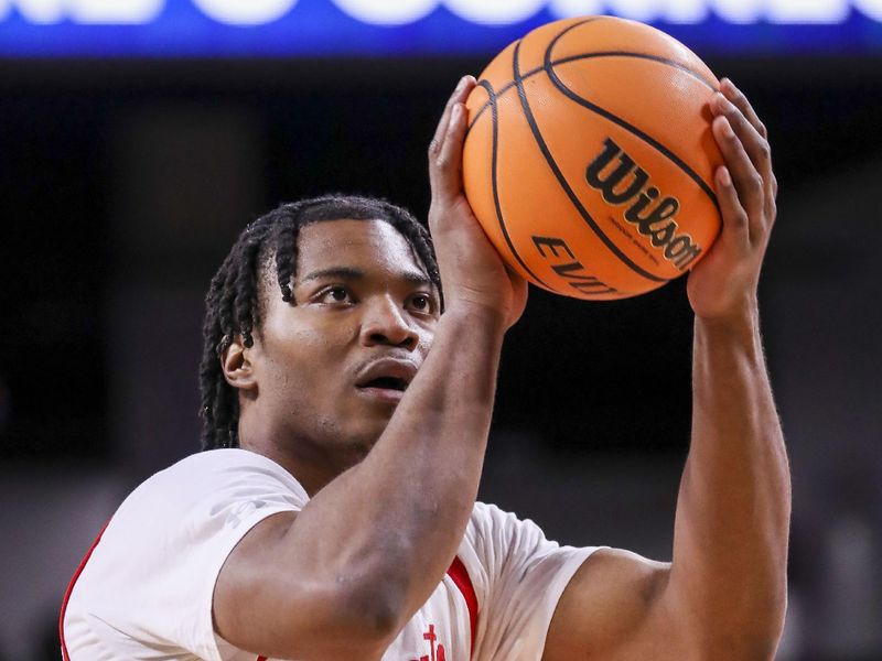 Feb 11, 2023; Cincinnati, Ohio, USA; Cincinnati Bearcats forward Kalu Ezikpe (1) shoots a free throw against the South Florida Bulls in the first half at Fifth Third Arena. Mandatory Credit: Katie Stratman-USA TODAY Sports