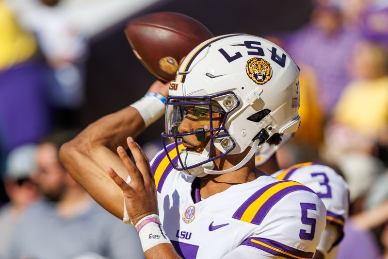 Nov 25, 2023; Baton Rouge, Louisiana, USA;  LSU Tigers quarterback Jayden Daniels (5) during warmups before the game against the Texas A&M Aggies at Tiger Stadium. Mandatory Credit: Stephen Lew-USA TODAY Sports