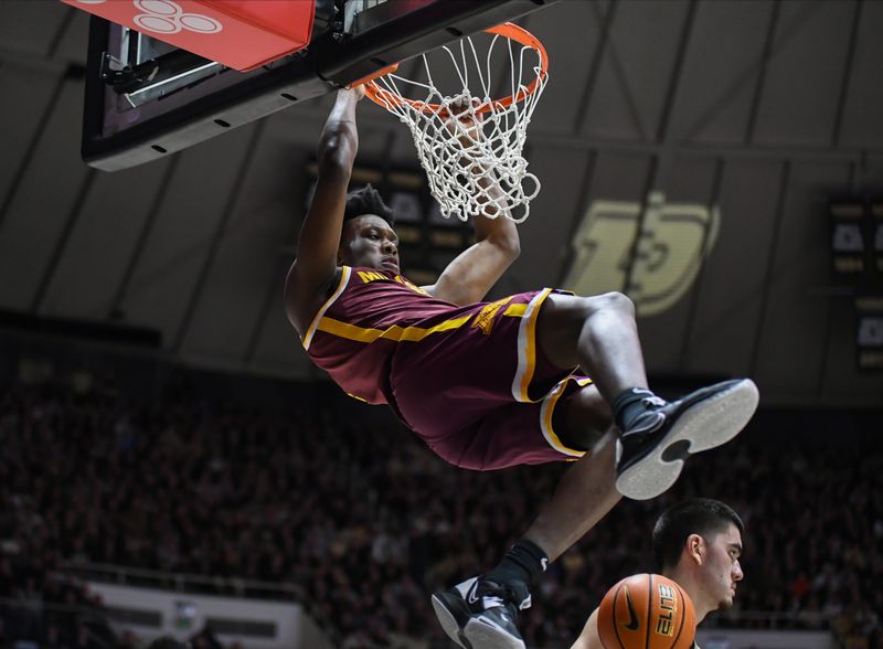 Feb 15, 2024; West Lafayette, Indiana, USA; Minnesota Golden Gophers forward Joshua Ola-Joseph (1) dunks the ball against the Purdue Boilermakers during the first half at Mackey Arena. Mandatory Credit: Robert Goddin-USA TODAY Sports