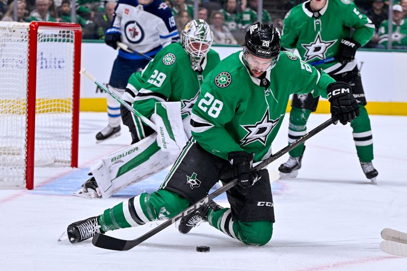 Dec 1, 2024; Dallas, Texas, USA; Dallas Stars defenseman Alexander Petrovic (28) blocks a Winnipeg Jets shot during the first period at the American Airlines Center. Mandatory Credit: Jerome Miron-Imagn Images