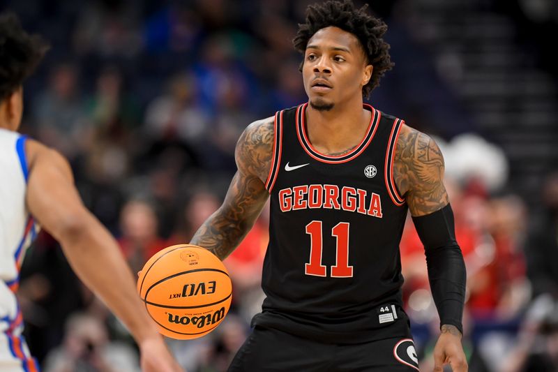 Mar 14, 2024; Nashville, TN, USA;  Georgia Bulldogs guard Justin Hill (11) dribbles against the Florida Gators during the first half at Bridgestone Arena. Mandatory Credit: Steve Roberts-USA TODAY Sports