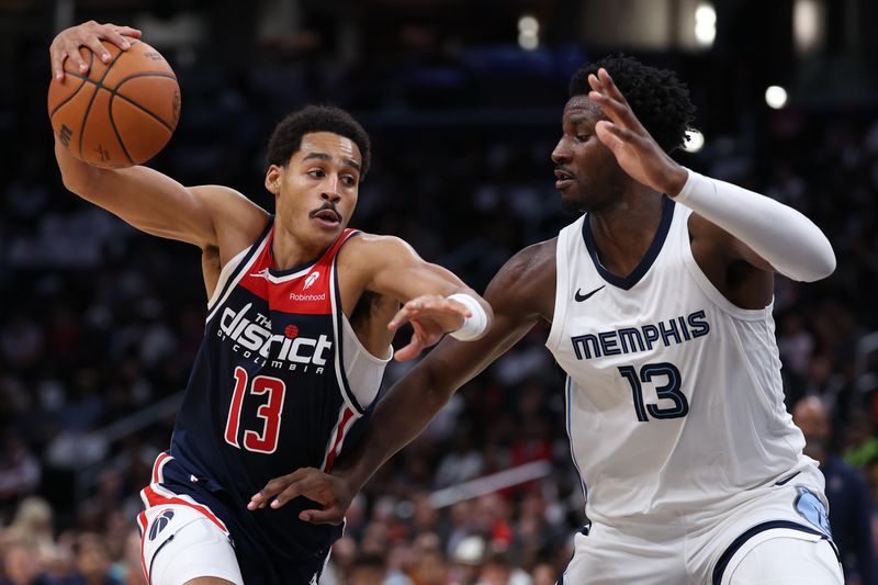 WASHINGTON, DC - OCTOBER 28: Jordan Poole #13 of the Washington Wizards dribbles past Jaren Jackson Jr. #13 of the Memphis Grizzlies during the first half at Capital One Arena on October 28, 2023 in Washington, DC. NOTE TO USER: User expressly acknowledges and agrees that, by downloading and or using this photograph, User is consenting to the terms and conditions of the Getty Images License Agreement. (Photo by Patrick Smith/Getty Images)