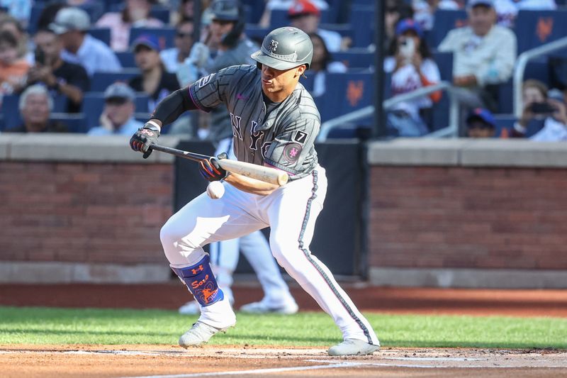 Sep 20, 2025; New York City, New York, USA; New York Mets right fielder Juan Soto (22) attempts to lay down a bunt in the first inning against the Washington Nationals at Citi Field. Mandatory Credit: Wendell Cruz-Imagn Images