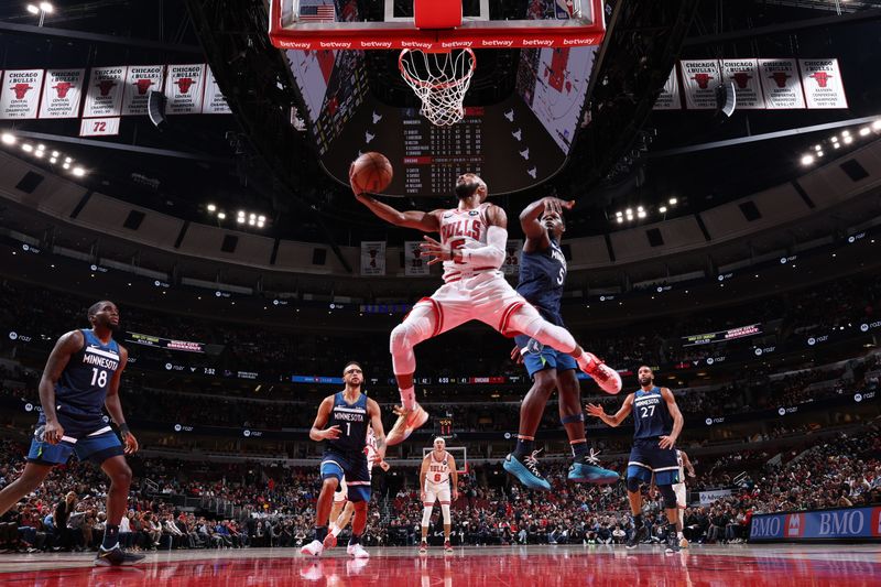 CHICAGO, IL - OCTOBER 19: Jevon Carter #5 of the Chicago Bulls drives to the basket during the game against the Minnesota Timberwolves on October 19, 2023 at United Center in Chicago, Illinois. NOTE TO USER: User expressly acknowledges and agrees that, by downloading and or using this photograph, User is consenting to the terms and conditions of the Getty Images License Agreement. Mandatory Copyright Notice: Copyright 2023 NBAE (Photo by Jeff Haynes/NBAE via Getty Images)