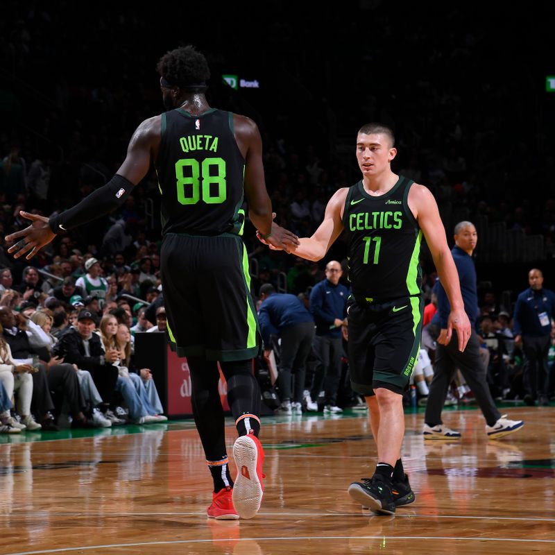 BOSTON, MA - NOVEMBER 25: Neemias Queta #88 high five during the game Payton Pritchard #11 of the Boston Celtics during the game against the LA Clippers on November 25, 2024 at TD Garden in Boston, Massachusetts. NOTE TO USER: User expressly acknowledges and agrees that, by downloading and/or using this Photograph, user is consenting to the terms and conditions of the Getty Images License Agreement. Mandatory Copyright Notice: Copyright 2024 NBAE (Photo by Brian Babineau/NBAE via Getty Images)