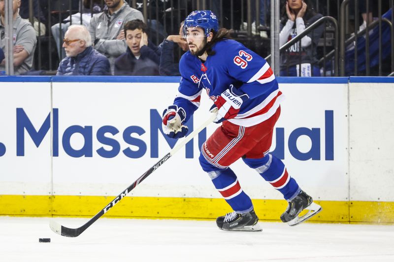 Apr 21, 2024; New York, New York, USA; New York Rangers center Mika Zibanejad (93) controls the puck against the Washington Capitals in game one of the first round of the 2024 Stanley Cup Playoffs at Madison Square Garden. Mandatory Credit: Wendell Cruz-USA TODAY Sports