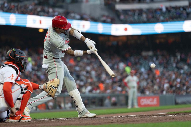 May 28, 2024; San Francisco, California, USA;  Philadelphia Phillies outfielder Nick Castellanos (8) hits a single during the fourth inning against the San Francisco Giants at Oracle Park. Mandatory Credit: Stan Szeto-USA TODAY Sports