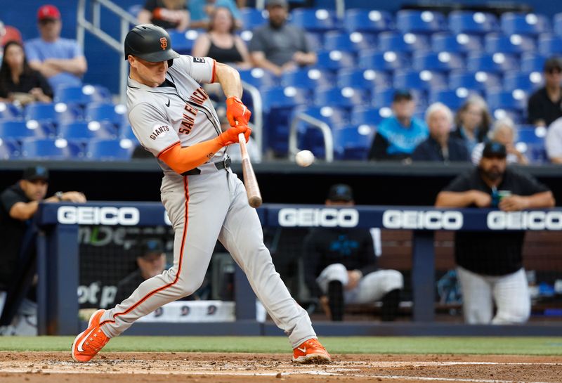 Apr 16, 2024; Miami, Florida, USA;  San Francisco Giants third baseman Matt Chapman (26) hits a home run against the Miami Marlins in the second inning at loanDepot Park. Mandatory Credit: Rhona Wise-USA TODAY Sports