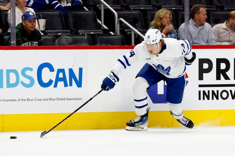 Oct 3, 2024; Detroit, Michigan, USA;  Toronto Maple Leafs center Bobby McMann (74) skates with the puck in the first period against the Detroit Red Wings at Little Caesars Arena. Mandatory Credit: Rick Osentoski-Imagn Images