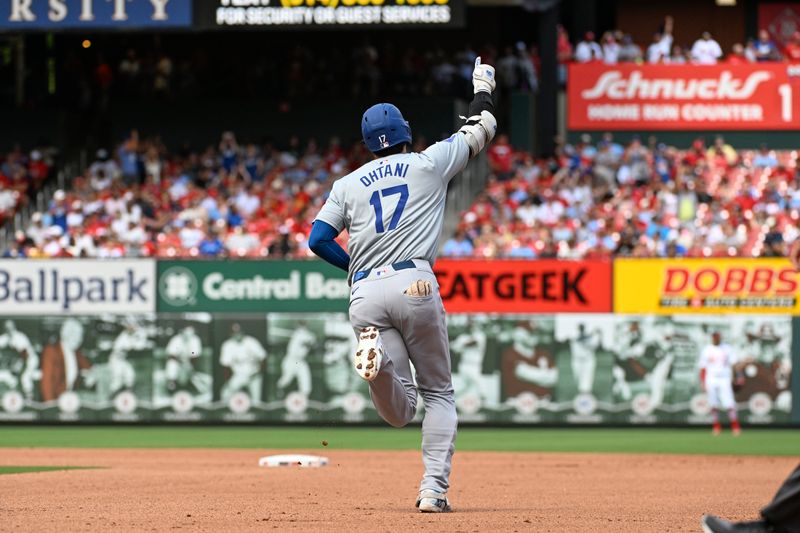 Aug 18, 2024; St. Louis, Missouri, USA; Los Angeles Dodgers designated hitter Shohei Ohtani (17) rounds the bases after hitting a solo home run against the St. Louis Cardinals in the fifth inning at Busch Stadium. Mandatory Credit: Joe Puetz-USA TODAY Sports