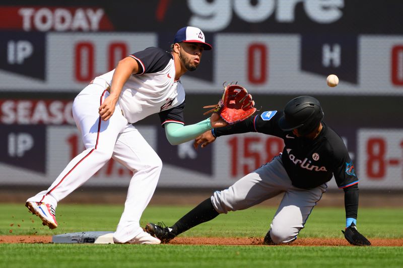 Sep 15, 2024; Washington, District of Columbia, USA; Miami Marlins shortstop Xavier Edwards (63) steals second base in front of Washington Nationals second baseman Luis Garcia Jr. (2) during the first inning at Nationals Park. Mandatory Credit: Rafael Suanes-Imagn Images