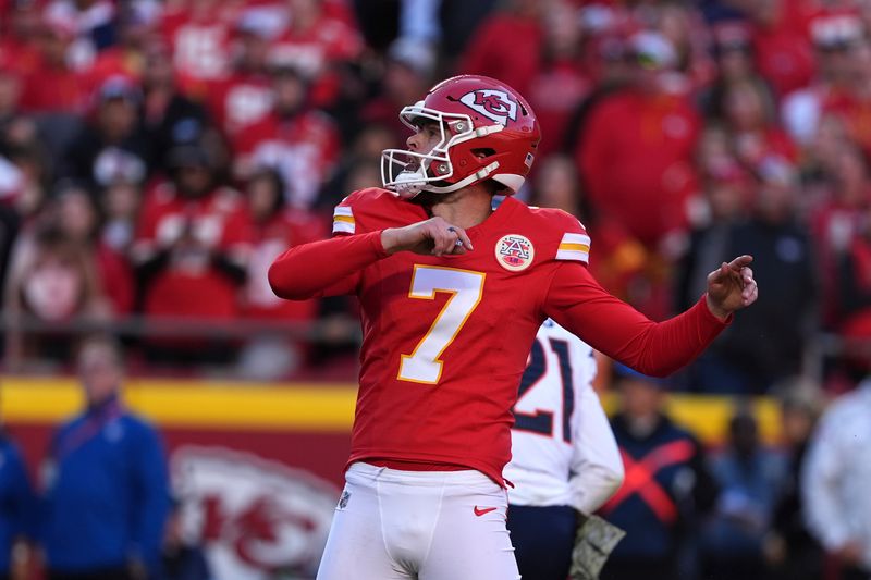 Kansas City Chiefs kicker Harrison Butker watches his 20-yard field goal during the second half of an NFL football game against the Denver Broncos Sunday, Nov. 10, 2024, in Kansas City, Mo. (AP Photo/Charlie Riedel)