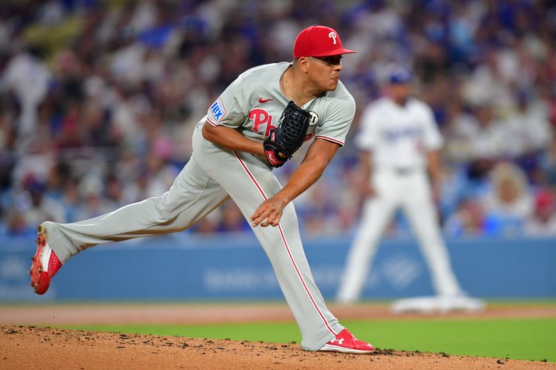 Sep 15, 2025; Los Angeles, California, USA; Philadelphia Phillies pitcher Ranger Suarez (55) throws pitch against the Los Angeles Dodgers in the first inning at Dodger Stadium. Mandatory Credit: Gary A. Vasquez-Imagn Images