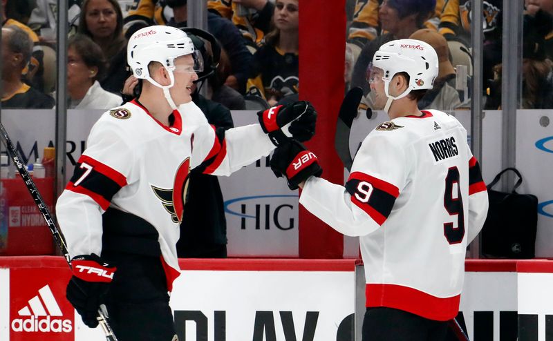 Oct 28, 2023; Pittsburgh, Pennsylvania, USA; Ottawa Senators left wing Brady Tkachuk (7) is congratulated by center Josh Norris (9) after Tkachuk scored a goal against the Pittsburgh Penguins during the first period at PPG Paints Arena. Mandatory Credit: Charles LeClaire-USA TODAY Sports