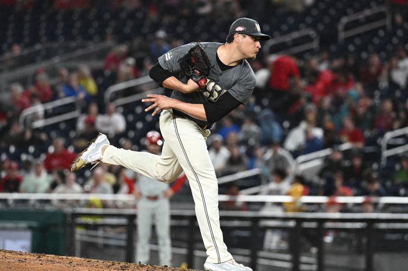 Sep 27, 2024; Washington, District of Columbia, USA;  Washington Nationals pitcher Robert Garcia (61) delivers pitch against the Philadelphia Phillies during the sixth inning at Nationals Park. Mandatory Credit: James A. Pittman-Imagn Images